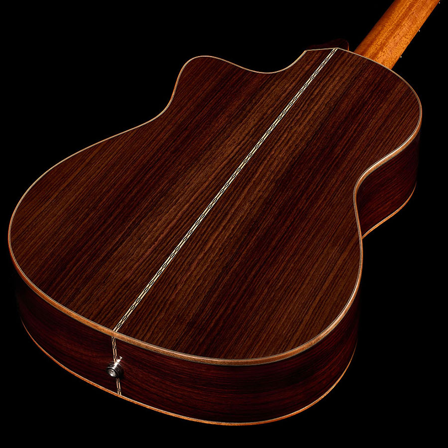 Back view showing the bookmatched rosewood back with its center seam and a metal endpin jack of the Orchestra CE Pro.