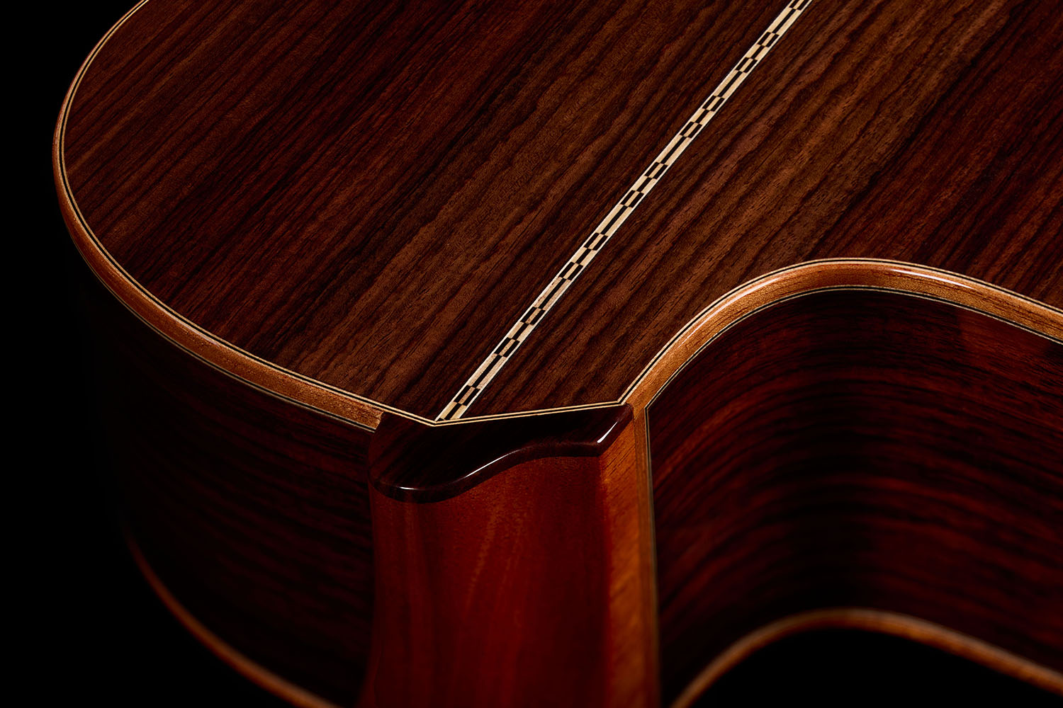 Close-up view of the neck heel, showing where the rosewood back meets the neck of the Orchestra CE Pro