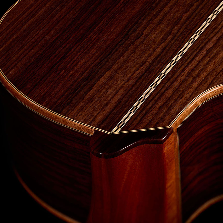 Close-up view of the neck heel, showing where the rosewood back meets the neck of the Orchestra CE Pro
