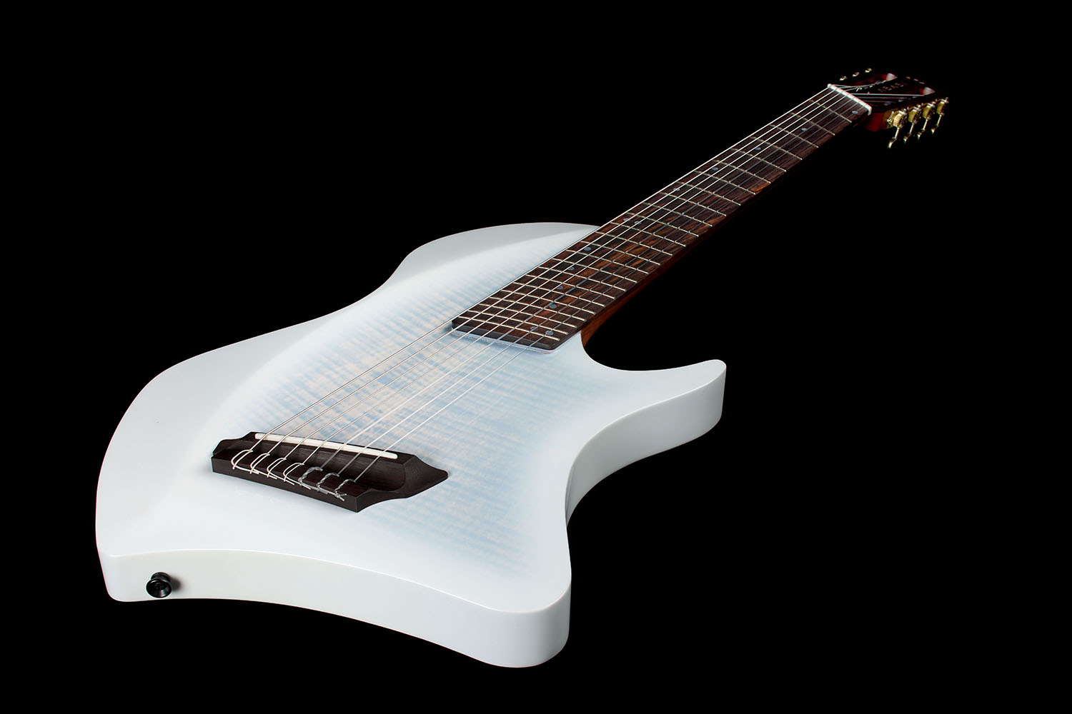 Close-up looking up the rosewood fretboard toward the Abasi Stage 7 White Burst's headstock and brass tuners, with the flame maple top visible below.
