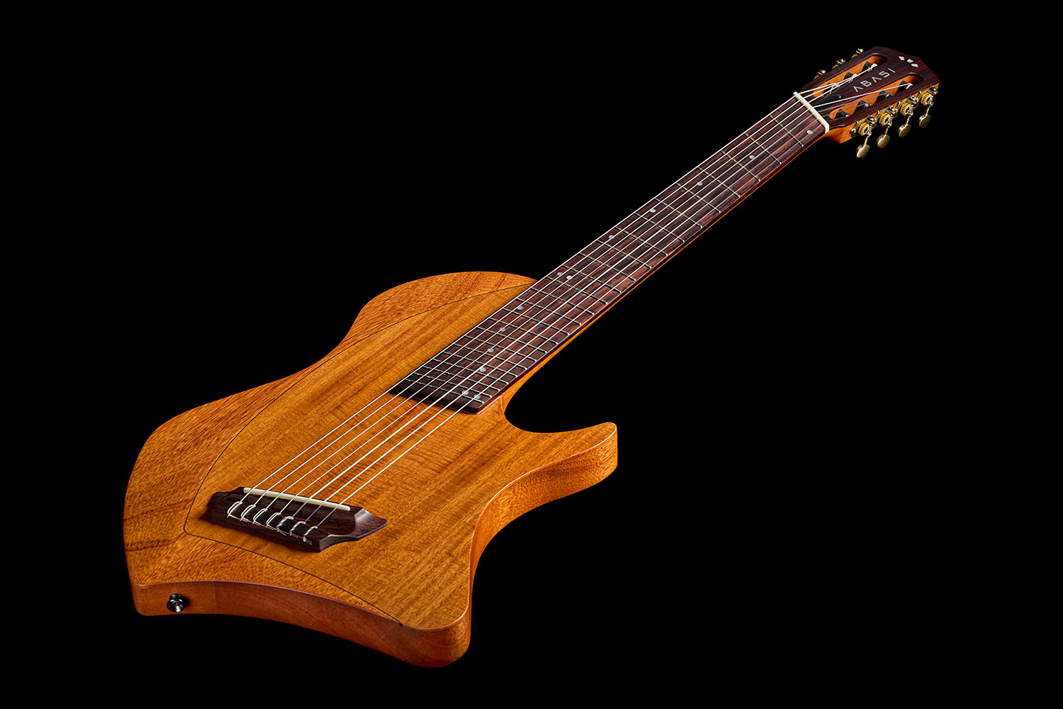 Angled view down the Abasi Stage 7 Acacia's neck, showing the fretboard binding and fanned frets leading to the headstock.