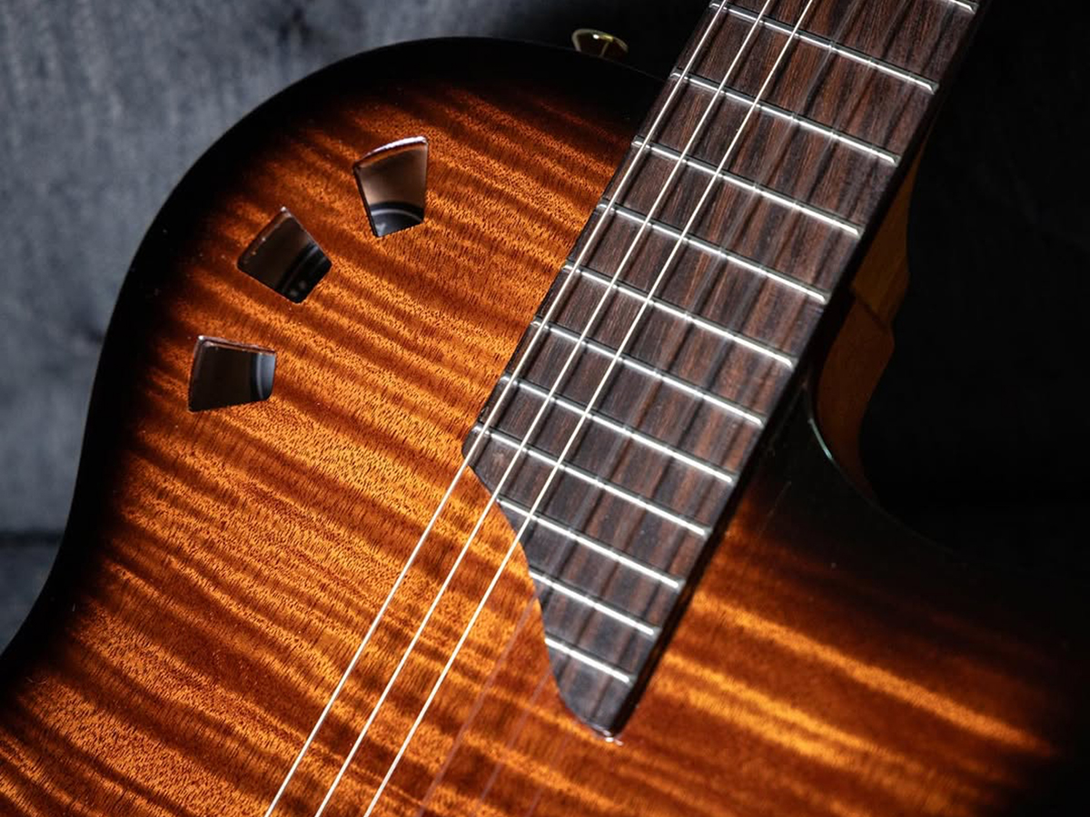 Close-up of Stage Edge Burst guitar body showcasing the exotic top veneer