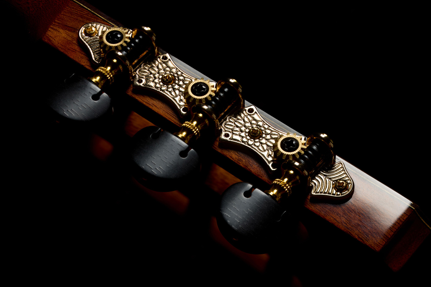 Close-up view of Córdoba Flower Petal tuners on the Stage Artist Habano Burst