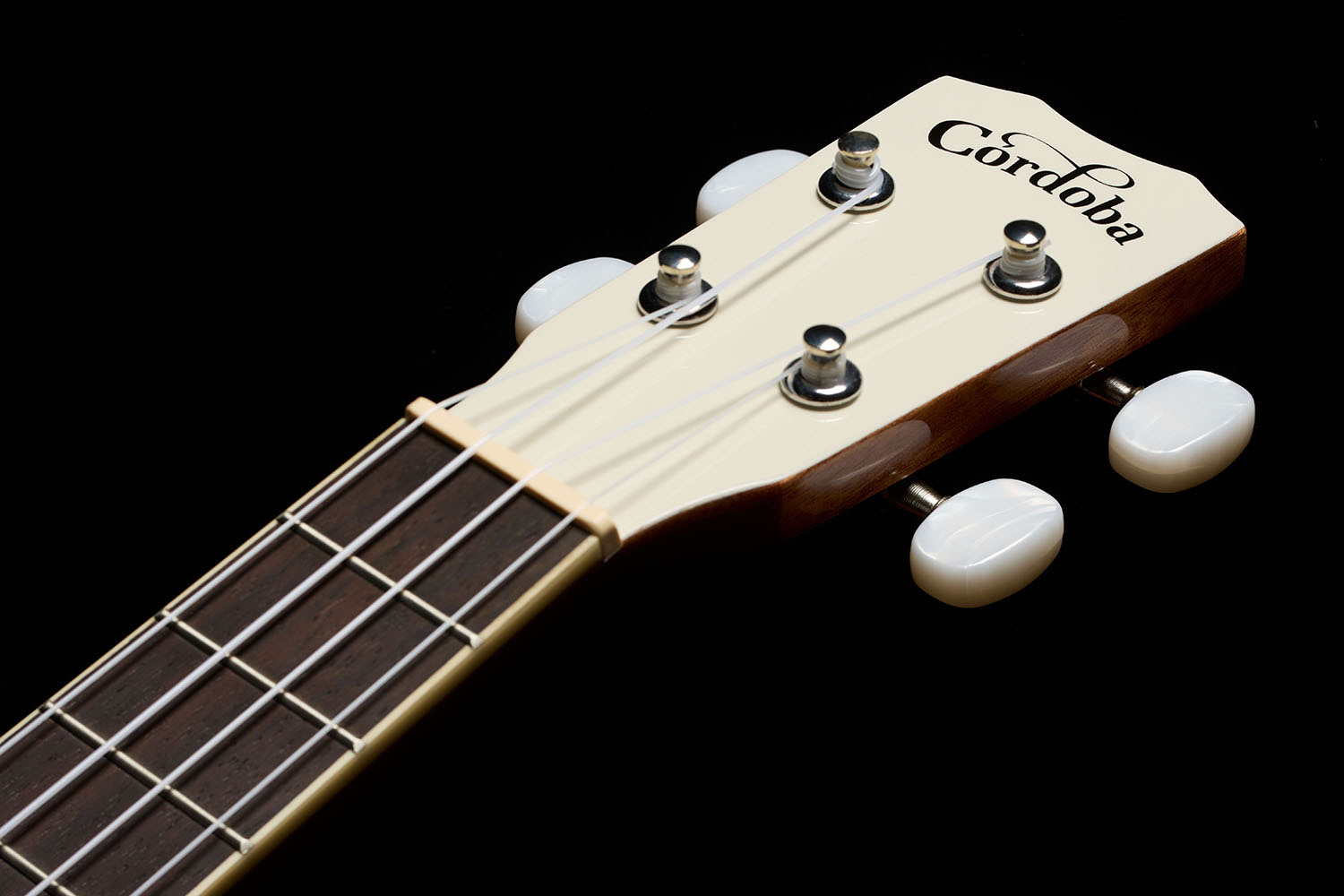 Close-up view of Córdoba 15C Mallorcan Pearl ukulele headstock