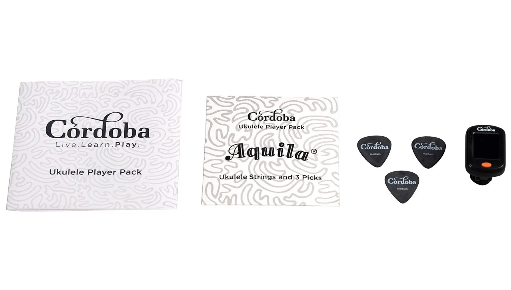 View of Ukulele Player Pack instructional booklet, Aquila strings, picks, and clip-on tuner