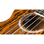 Close-up view of 15Tb-E ukulele soundhole thumb