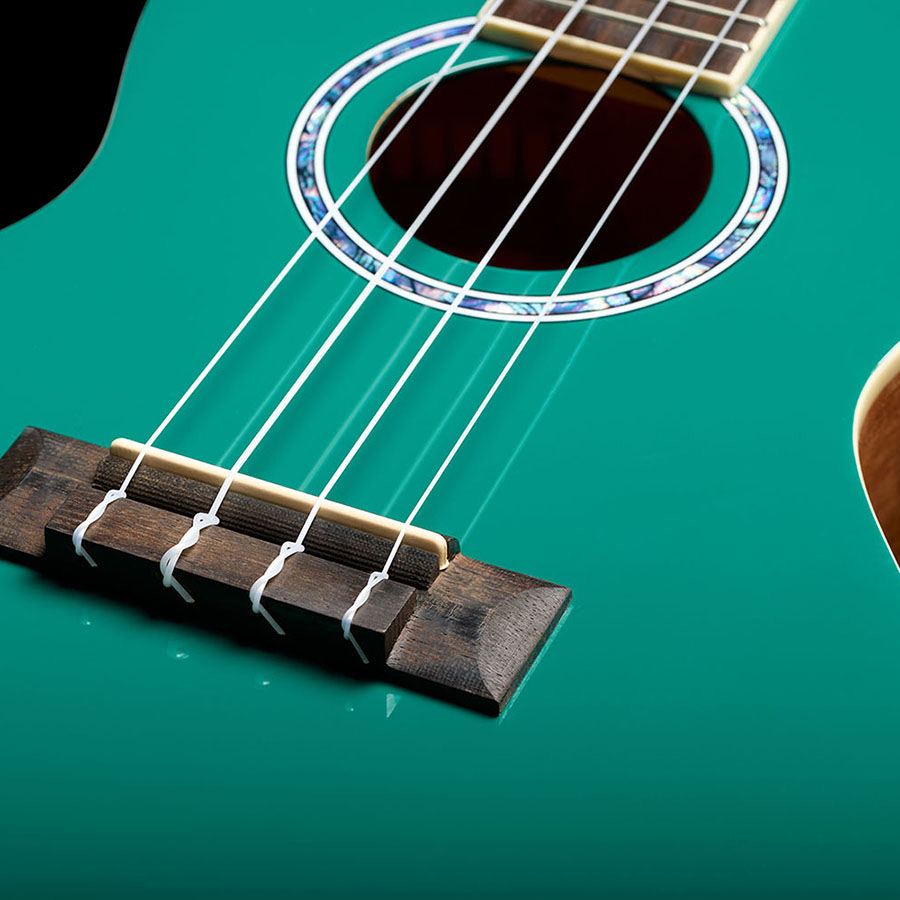 Close-up of the bridge of Córdoba 15C Catalonia Green ukulele thumbnail