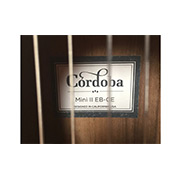 Inside view of the soundhole of Mini II EB-CE showing the Córdoba label thumb