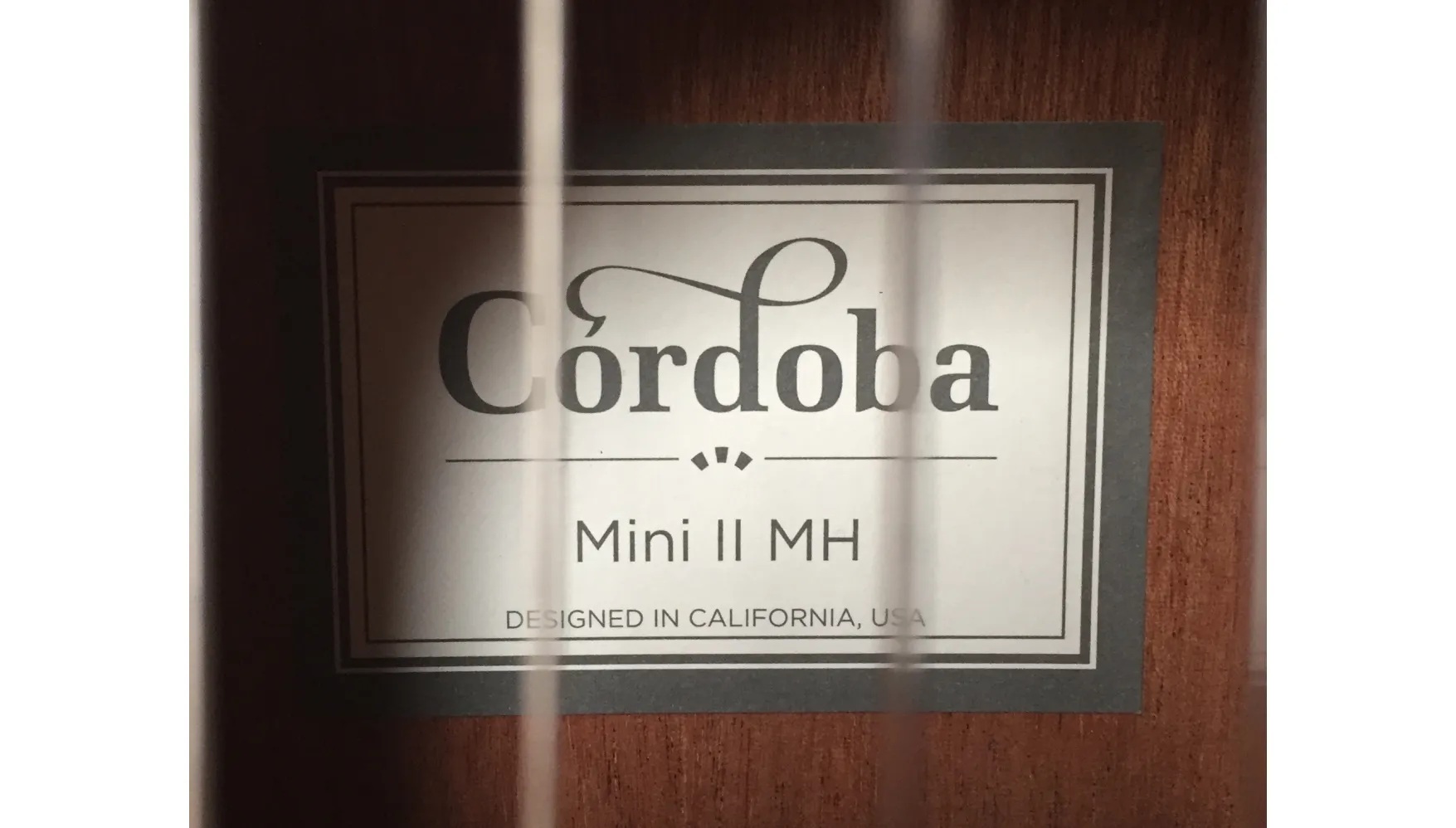 Inside the soundhole of the Mini II MH showing the Córdoba label