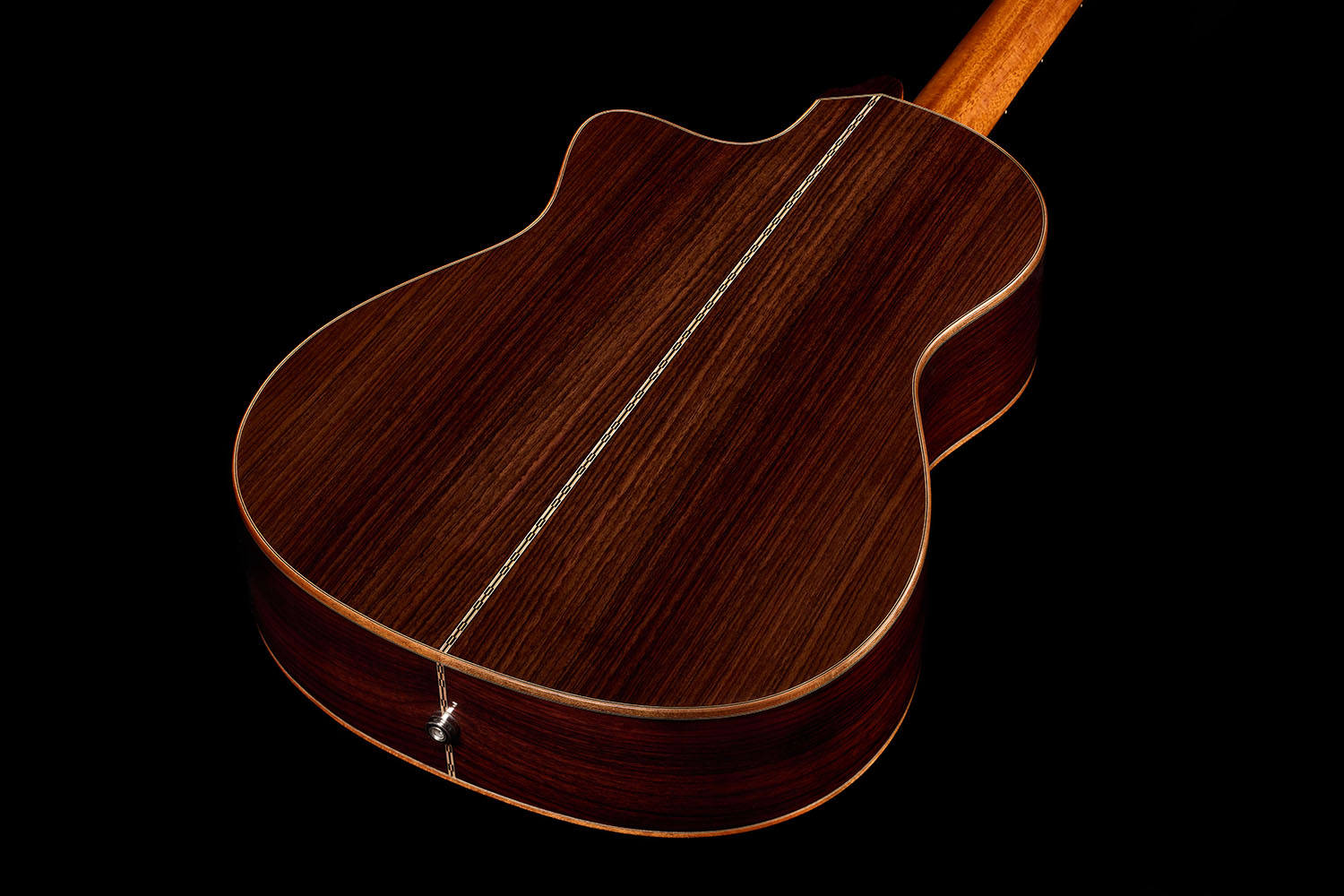 Back view showing the bookmatched rosewood back with its center seam and a metal endpin jack of the Orchestra CE Pro.